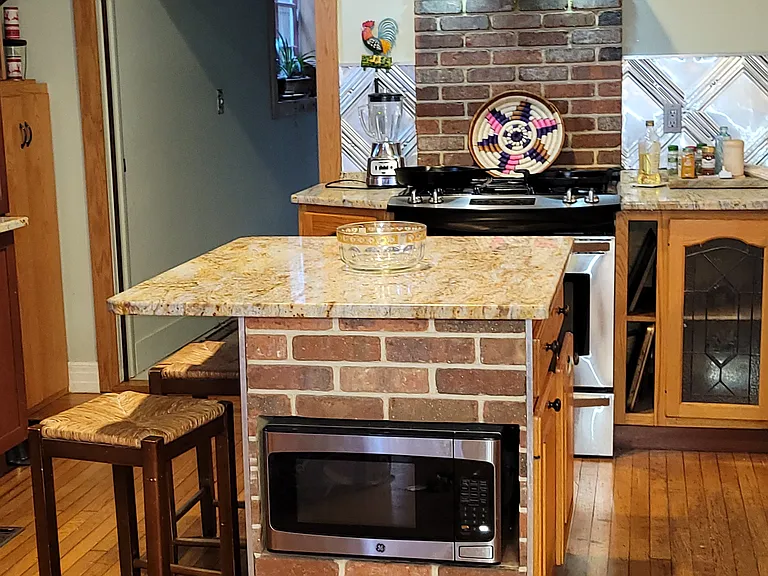 Center island with microwave of kitchen 30 inch high end stove under stainless steel hood