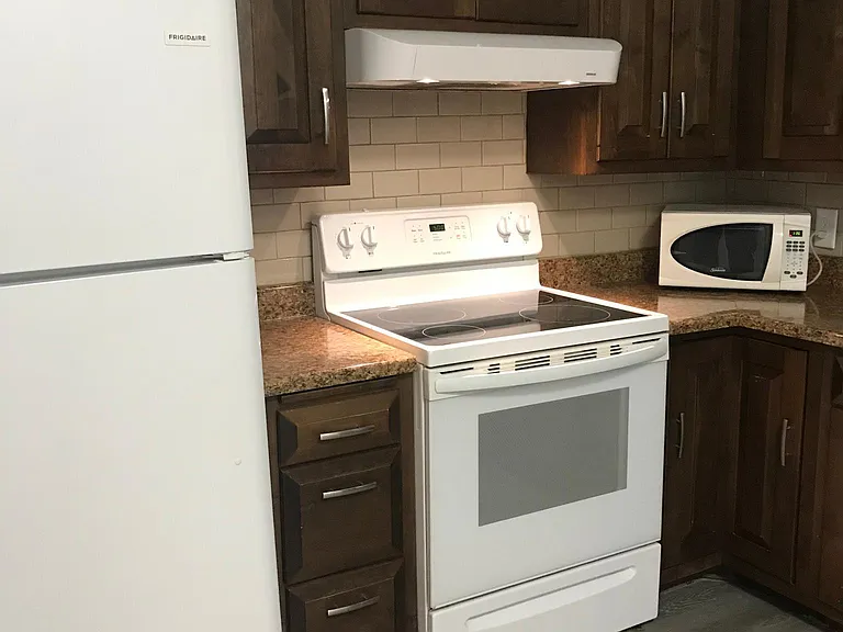All appliances in white. These cabinets came with the house, but we may change them to a brighter look in what we call BEECH 2.0!