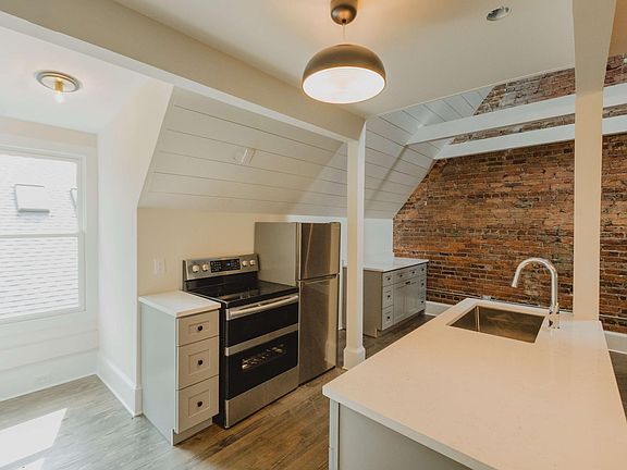 Stone countertops and exposed brick!