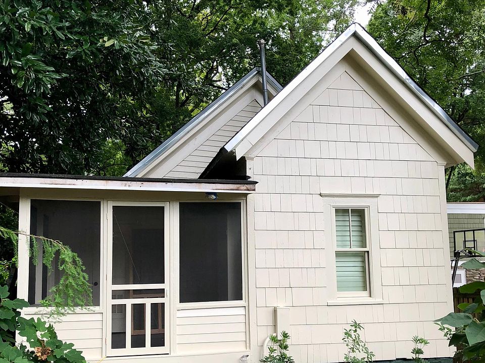 Front of cottage view from shared fenced yard.