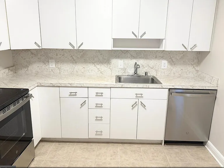 Kitchen has new cabinetry and granite countertops since photo was taken.