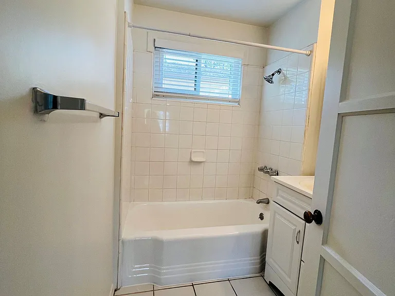 Bright and light bathroom with tub and shower