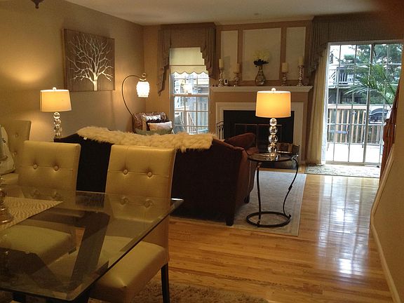Living room with sliding glass doors to large deck.