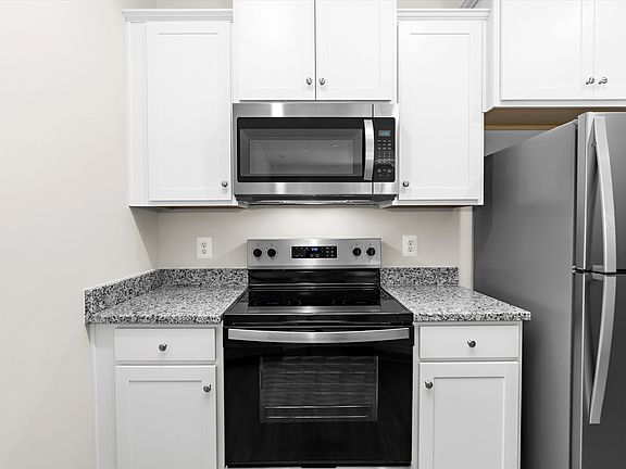 The kitchen has granite countertops