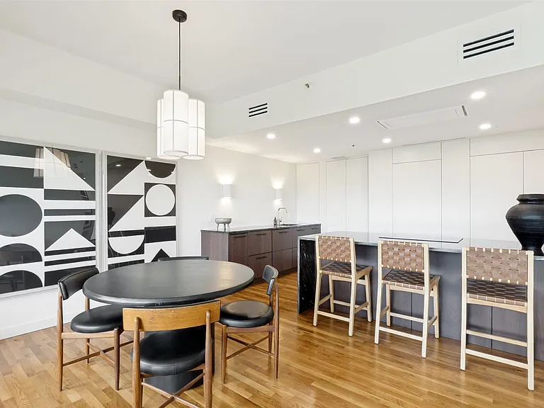 Red Oak hardwood flooring with a Golden Oak finish, unites all the rooms as a whole.