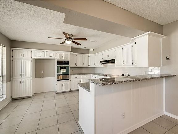 Kitchen has updated granite countertops