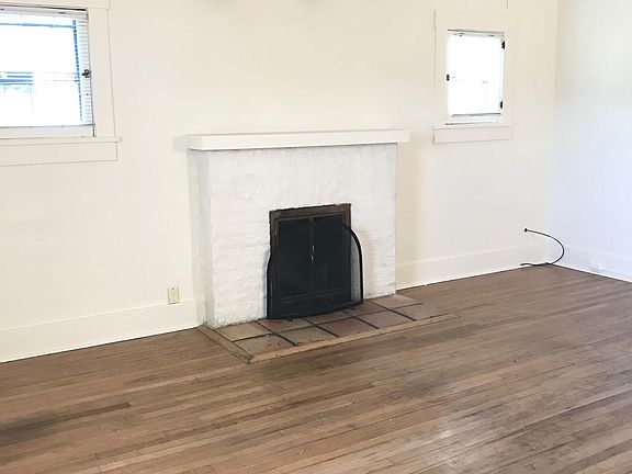 Living room with wood burning fireplace