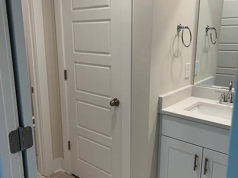 view of master bath linen closet and toilet closet