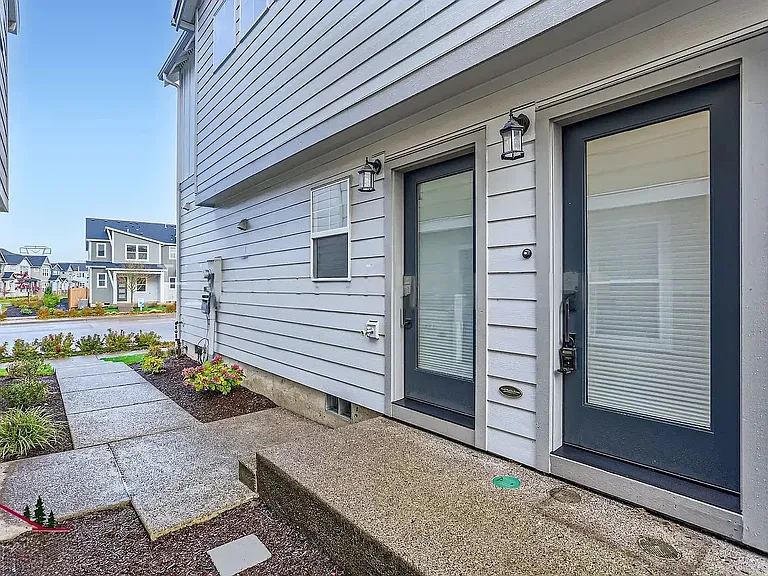 Separate entrance to available unit is the door on the left.
