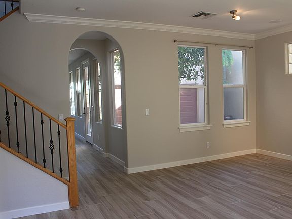 Living room has space for formal dining area.