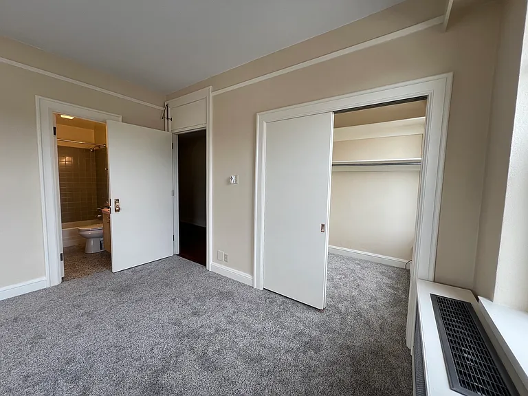 Primary bedroom closet and bathroom