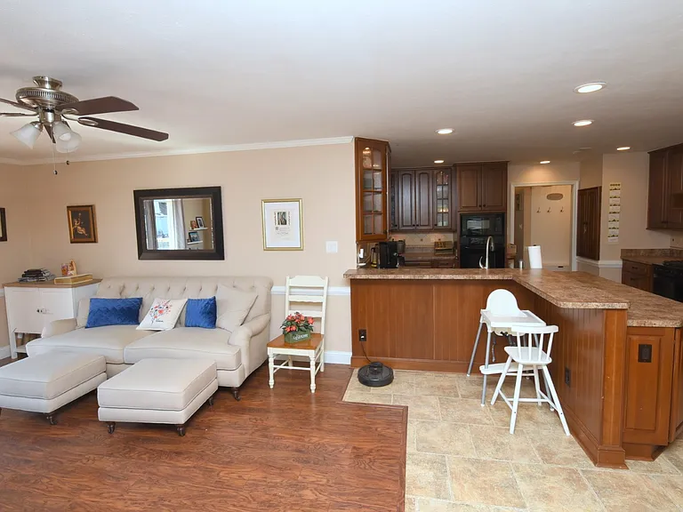 Kitchen opens to living and eating areas.