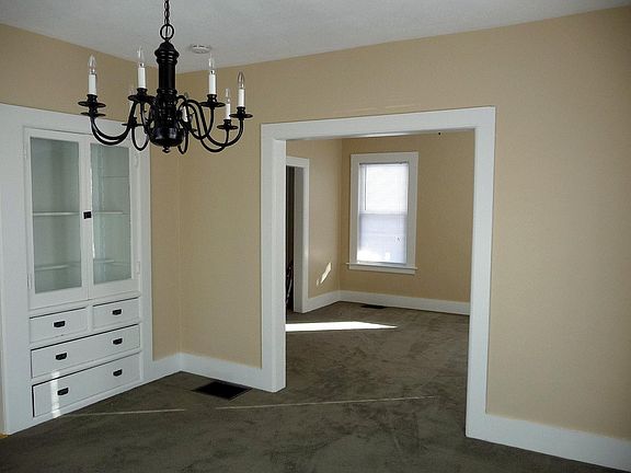 Dining room with built in hutch and open to living room
