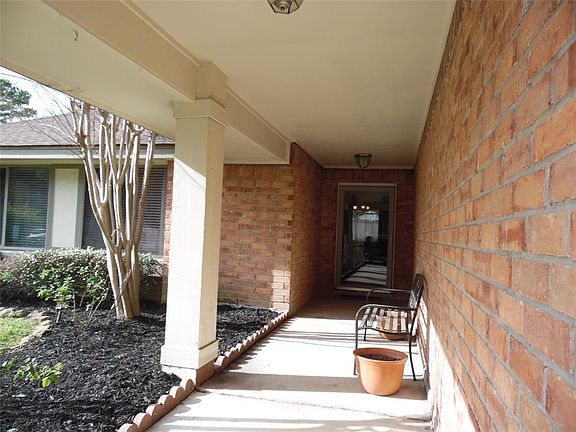 Nicely landscaped yard and look at the front breezeway that leads to the storm glass door and oak front door with a program lock.