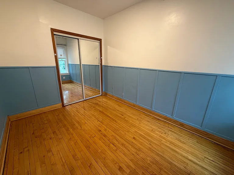 Queen-sized bedroom, window facing backyard