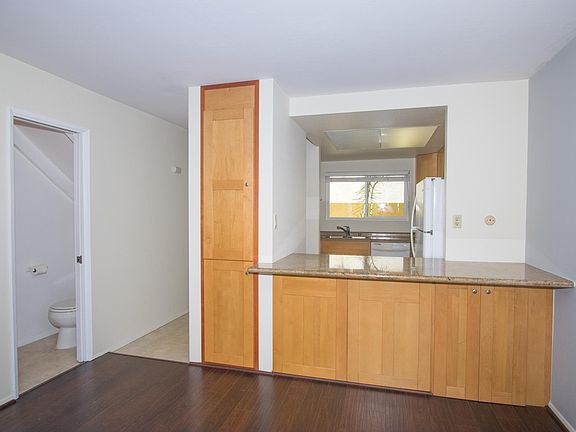 Lots of storage in unit, looking from living room to kitchen