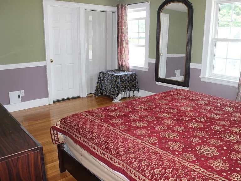 Master Bedroom - Build in Full size wall mirror. Left door in pic is bathroom door and shutter door is His closet
