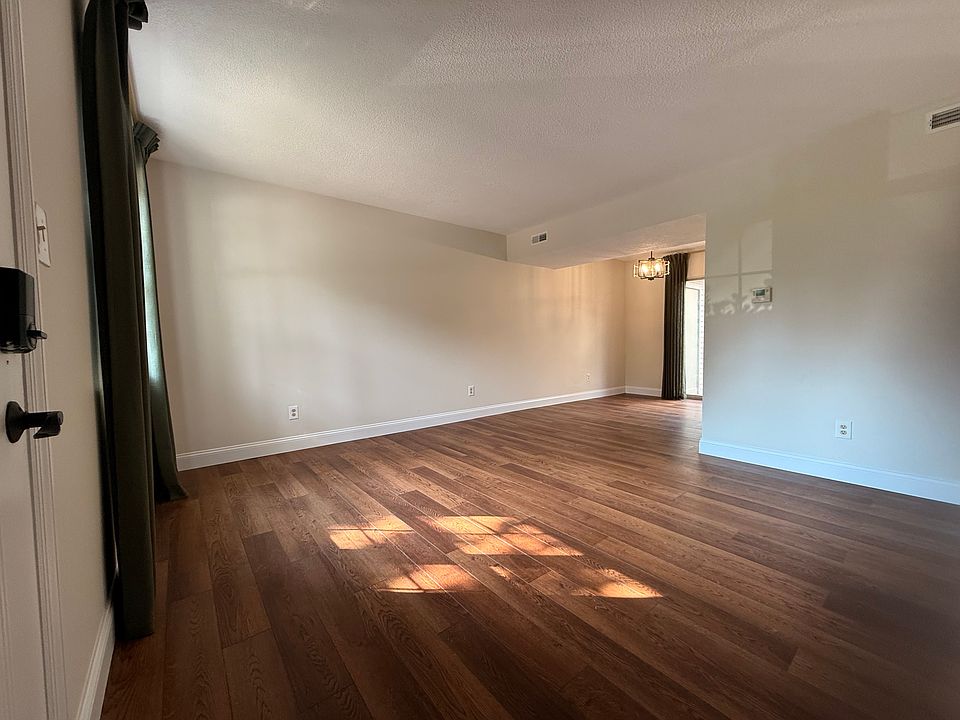 New LVP floors, large walk-in storage closet under the stairs. Open to dining and kitchen.