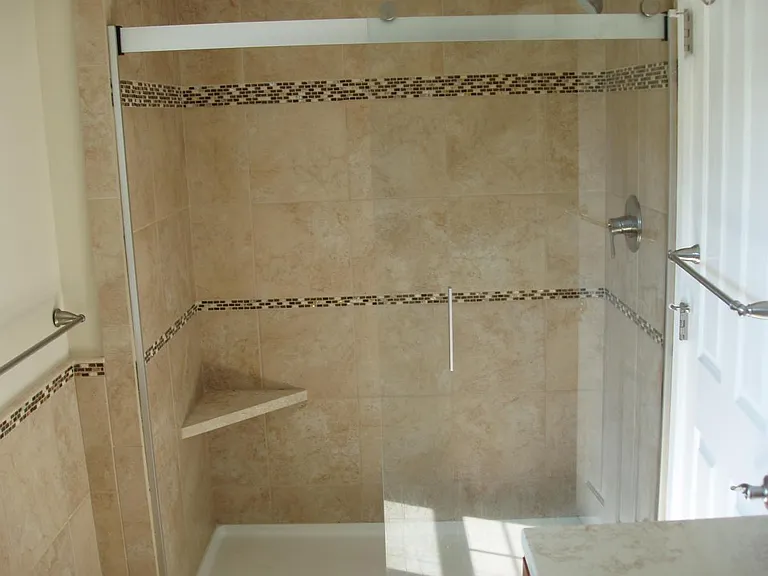 Master bedroom bath with tiled shower.