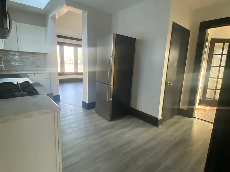 view of kitchen and through kitchen from back door entrance