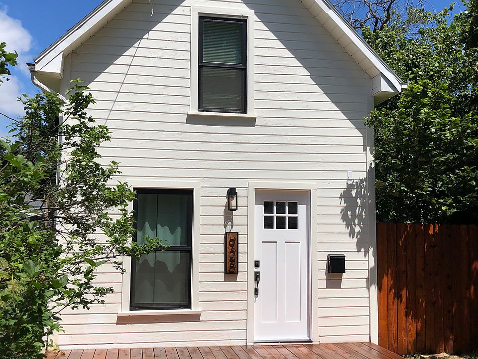 Front yard, includes one off street parking space, gate to large backyard.