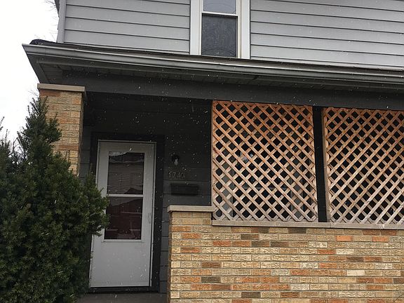 Front door with partially enclosed porch