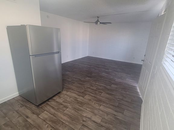 Open living room space. ceiling fans in every room.
