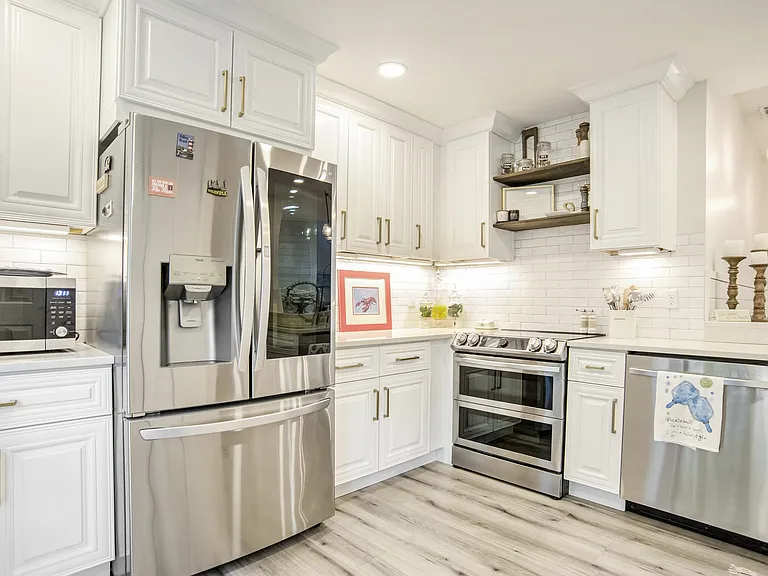 A chef's dream! This fully updated kitchen features stainless steel appliances, quartz countertops, custom cabinetry, and stylish open shelving. Perfect for preparing meals before heading out to explore Hilton Head!