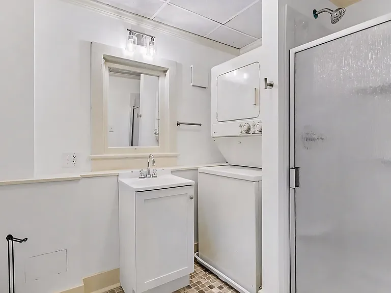 Bathroom with laundry area, washer and dryer