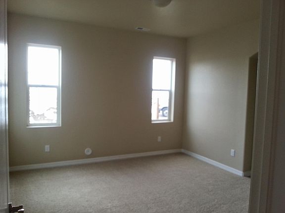 Main floor master bedroom with attached bath and walk in closet.