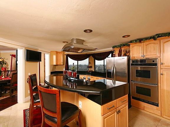 Travertine floors, granite counters, stainless appliances dramatic views!