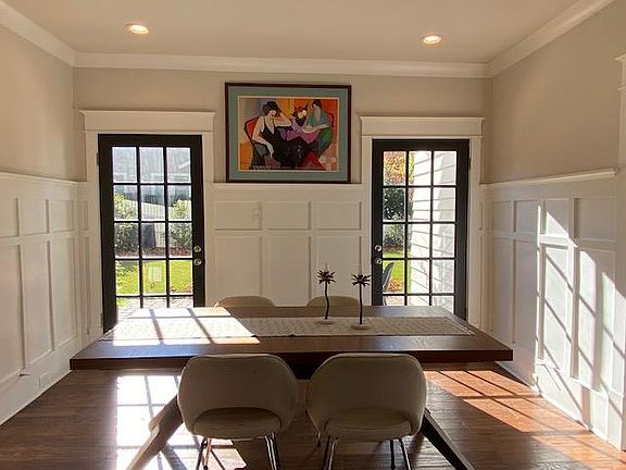 bright dining area, with direct access to patio and fenced in yard