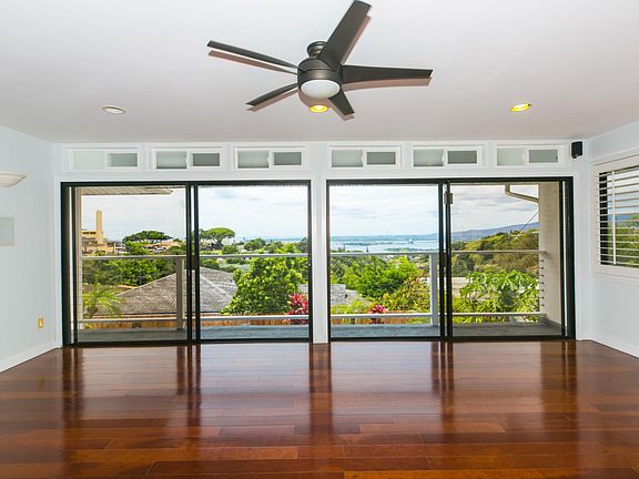 Large double sliding doors lead out to balcony. Feel the cool breezes throughout the room!