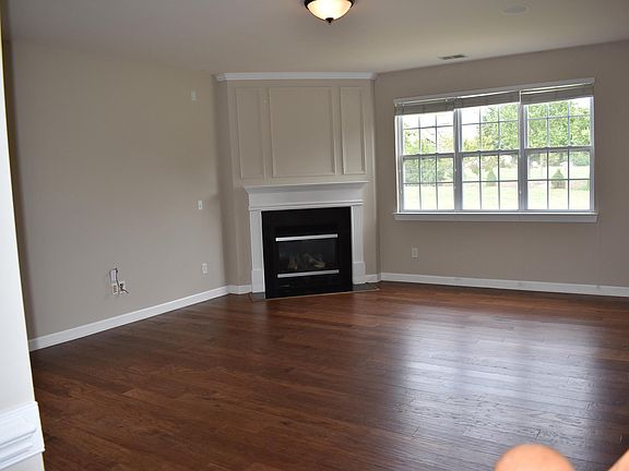 Open family room. There are also windows on the far corner of left wall. Light and bright!