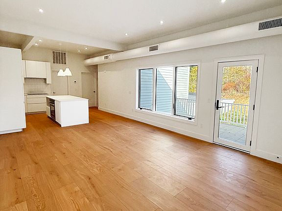 living room with access to private deck