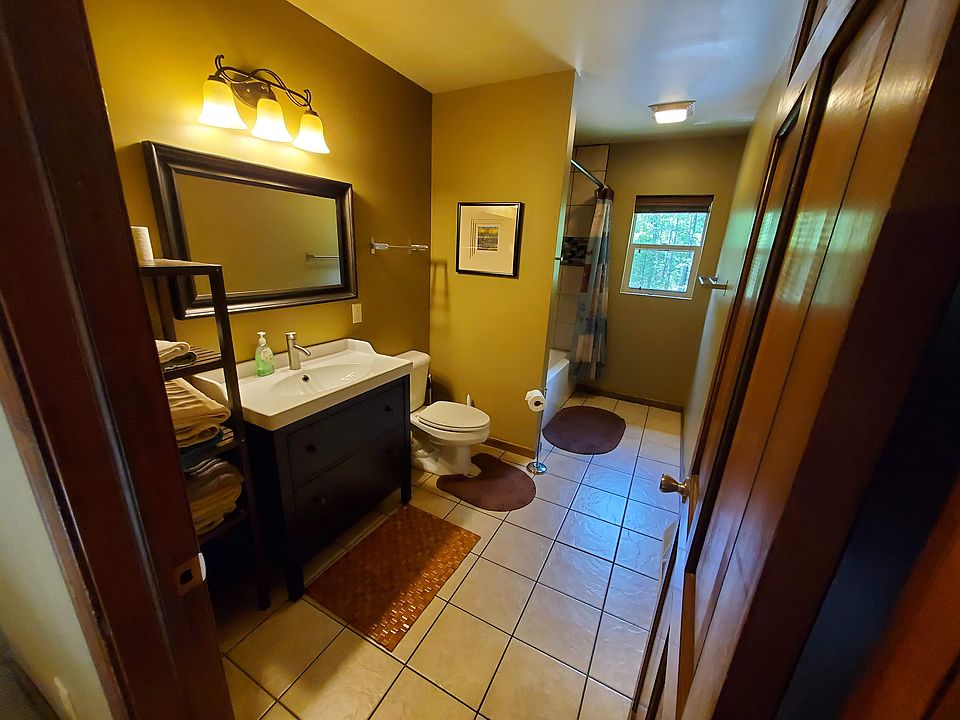 2nd floor bathroom with bathtub and shower