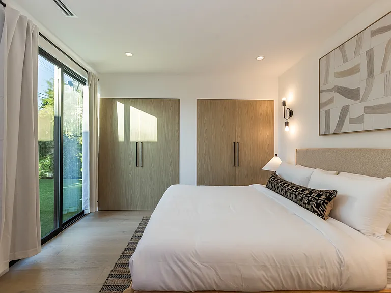 Bedroom three, has two large closets and in suite bathroom with openings to the backyard.