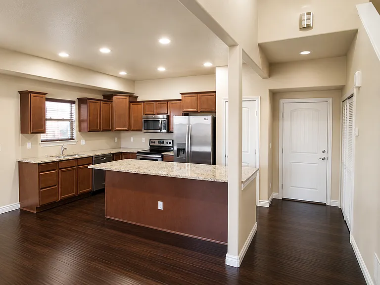 Granite countertops, stainless steel appliances, recessed lighting, and a layout that actually works.