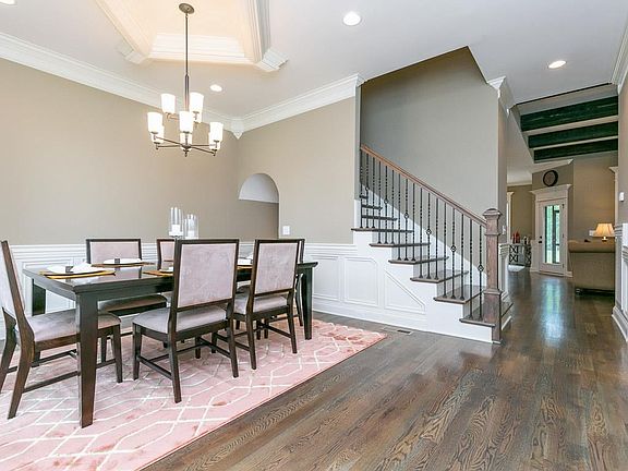 Beautiful formal dining room greets you as you enter the home.