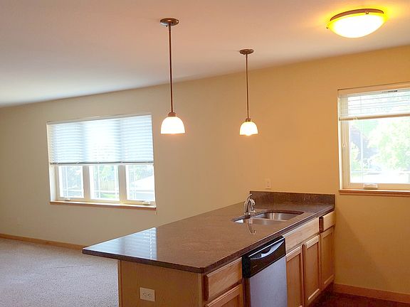 Open concept kitchen, living, dining area.