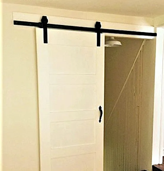 Barn door leads into the kitchen