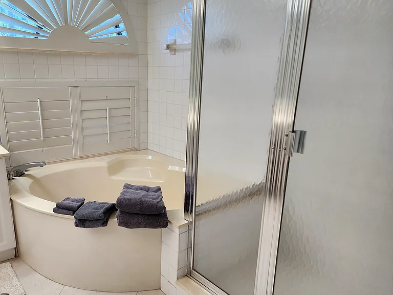 Ensuite master bathroom with large, 2 person soaking tub and walk-in shower.