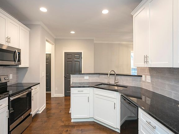 updated kitchen, granite counters, stainless steel appliances, 2 pantries and modern backsplash