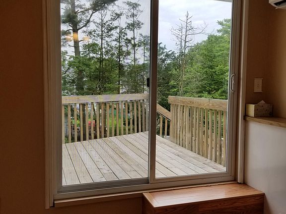 Doors from kitchen leading to deck on second floor
