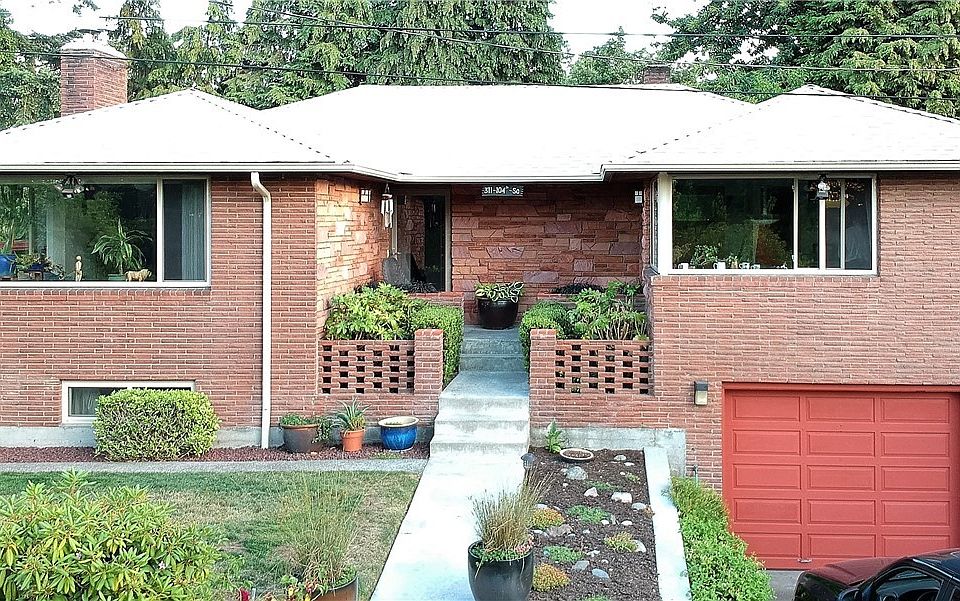 Well maintained mid-century home with low-maintenance, Roman-brick exterior!