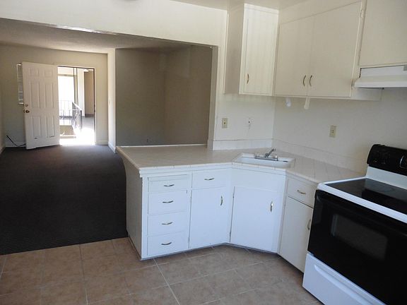 Kitchen looking into living room