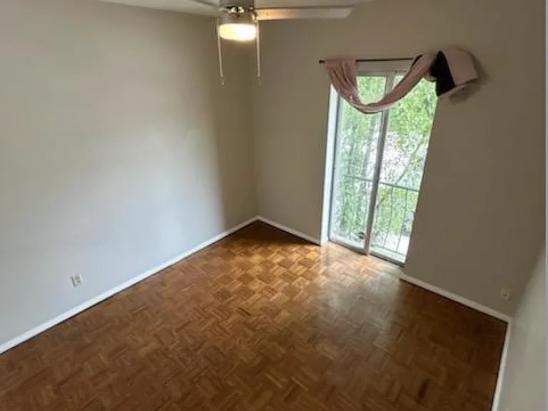 Bedroom three with brand-new ceilin fan and closet