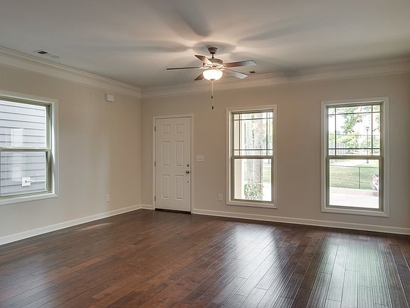 Large den with plenty of light and hardwoods