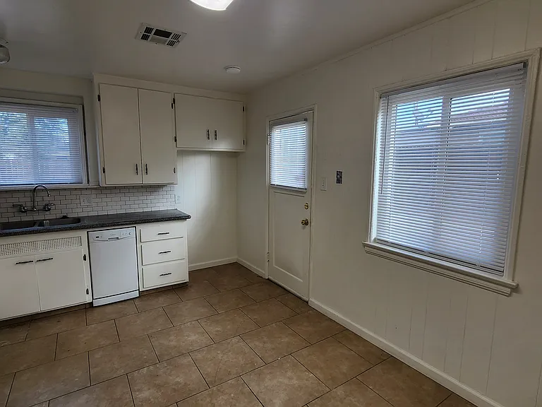 Kitchen with back door door to driveway.