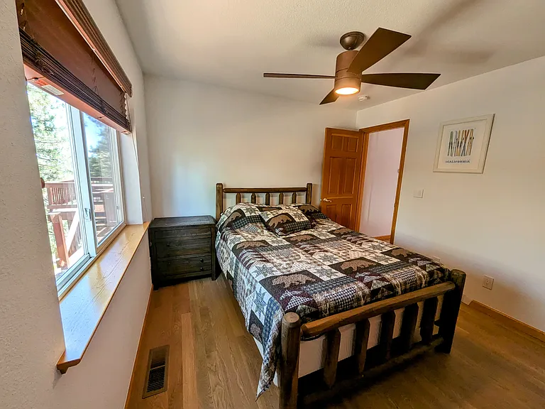 Downstairs bedroom with queen bed